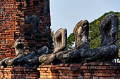 Ayutthaya, Thailand. Wat Chaiwatthanaram, headless Buddha statues of the gallery. 